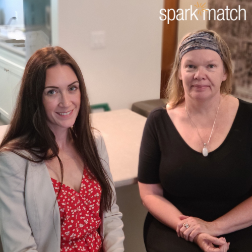 Two women standing in a kitchen